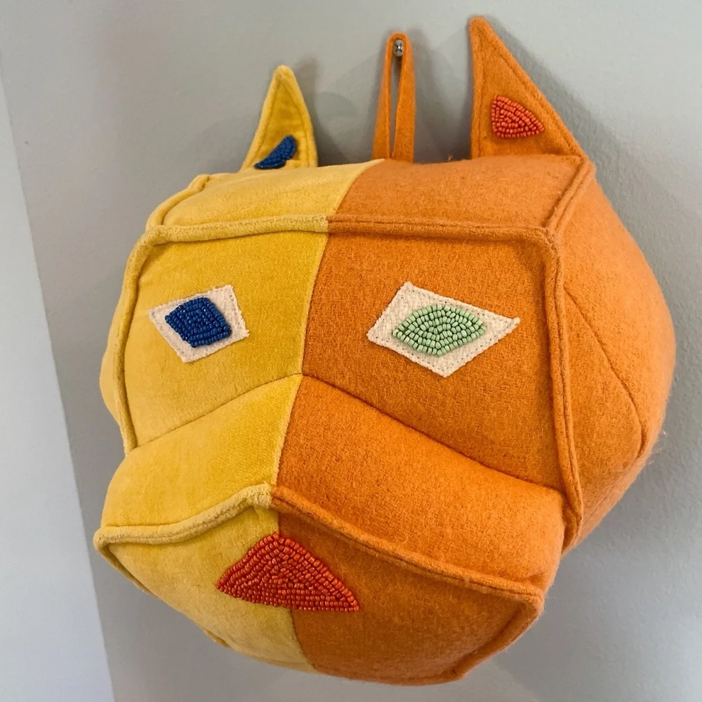 Domino x Crate & Barrel colorful dog head wall decor